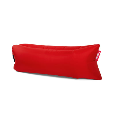 Lamzac 3.0 de Fatboy : la chaise longue gonflable imperméable qui se déploie en un clin d'œil, offrant confort et durabilité pour toutes vos escapades en extérieur. Rouge.
