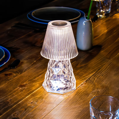 Lampe de table Lola Lux : polyamide transparent, touches de miroir, luminosité réglable, autonomie de 50 heures. Un éclairage d'appoint moderne et stylé.