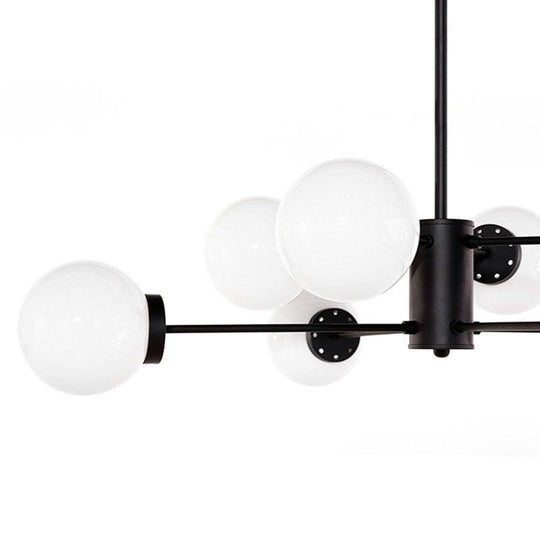 Suspension lumineuse Dylan : disponible en noir mat ou doré mat, elle s'intègre harmonieusement dans divers décors, offrant élégance et style distinctif.